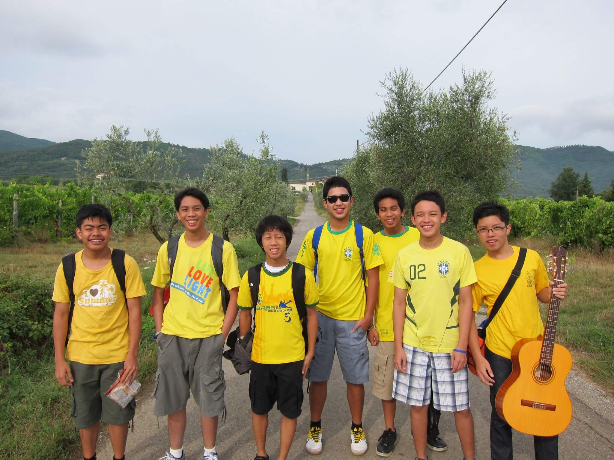 A group of young men standing together, symbolizing
